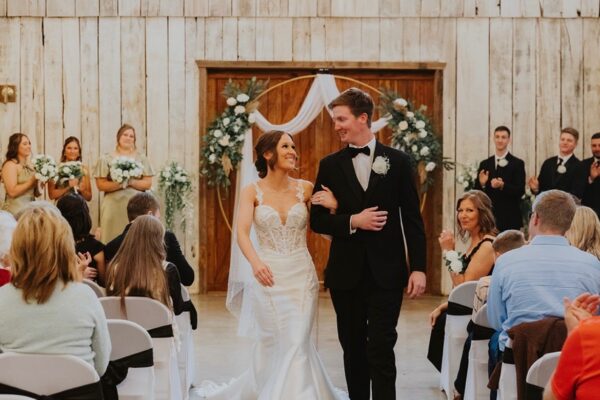 bride and groom walking down aisle